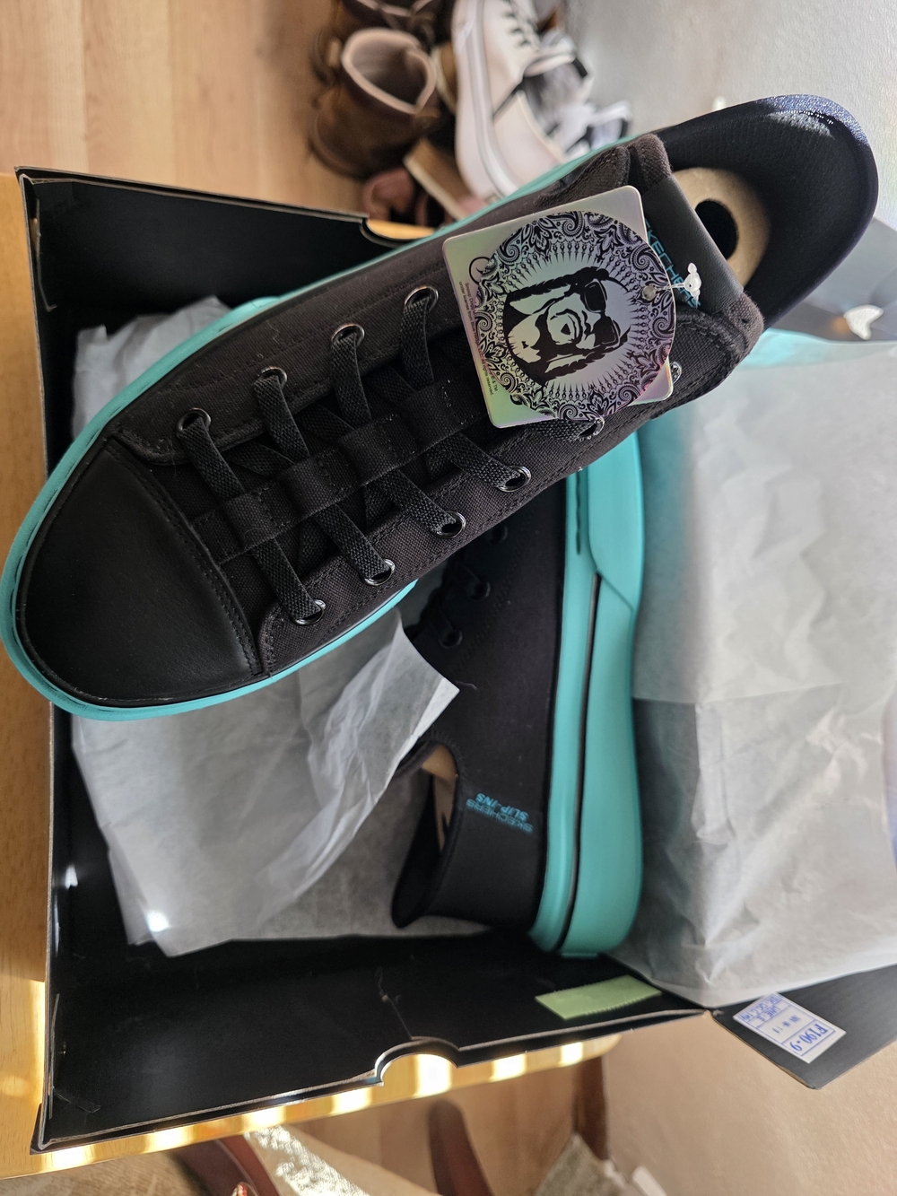 Skechers Black Low-Top Sneakers with Teal Accent Sole